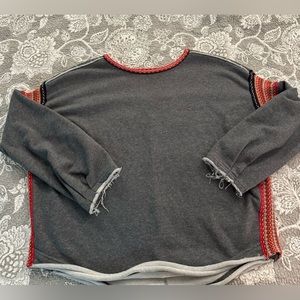 Natural Life sweatshirt with frayed edges and crochet detail.